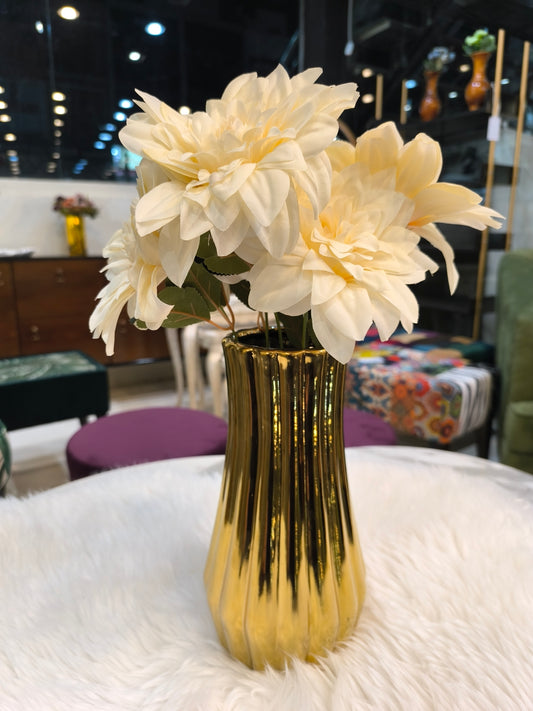 Golden ceramic vase with flowers